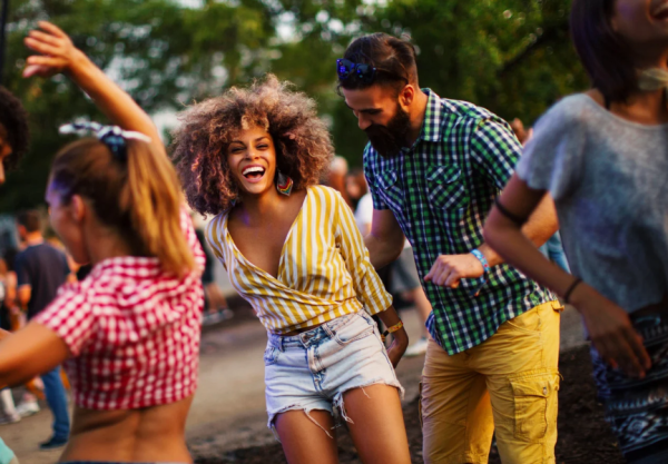 People dancing at outdoor country music festival